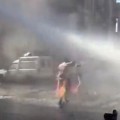 Protester Gets Nailed By Water Cannon