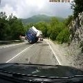 Truck Tips Over Slides Headlong Into Oncoming Car