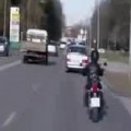 Biker Crashes Into Police Car