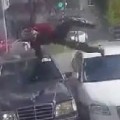 Biker Crashes And Lands Safely Between Two Cars