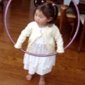 Little Girl Tries to Hula Hoop