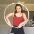 Girl Performs Hypnotizing Dance with Hula Hoop