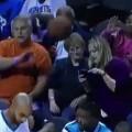 Distracted Fan Gets Hit In The Face By Basketball