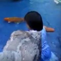 Little Girl Swims In Mall's Koi Pond