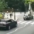 Woman Tries To Beat Car Across The Street
