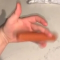 Thumb for Teen spins hot dog between fingers