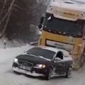 Audi pulls truck up snowy hill