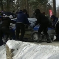 Racing car crashes into ditch but fans dig it out