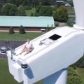 Drone Catches A Man Sunbathing On A Wind Turbine