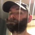Thumb for Dude uses drill to trim his beard